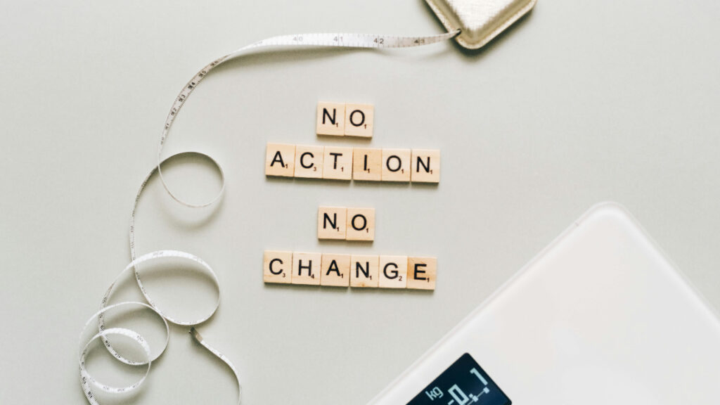 Motivational message using Scrabble tiles: No action, no change.